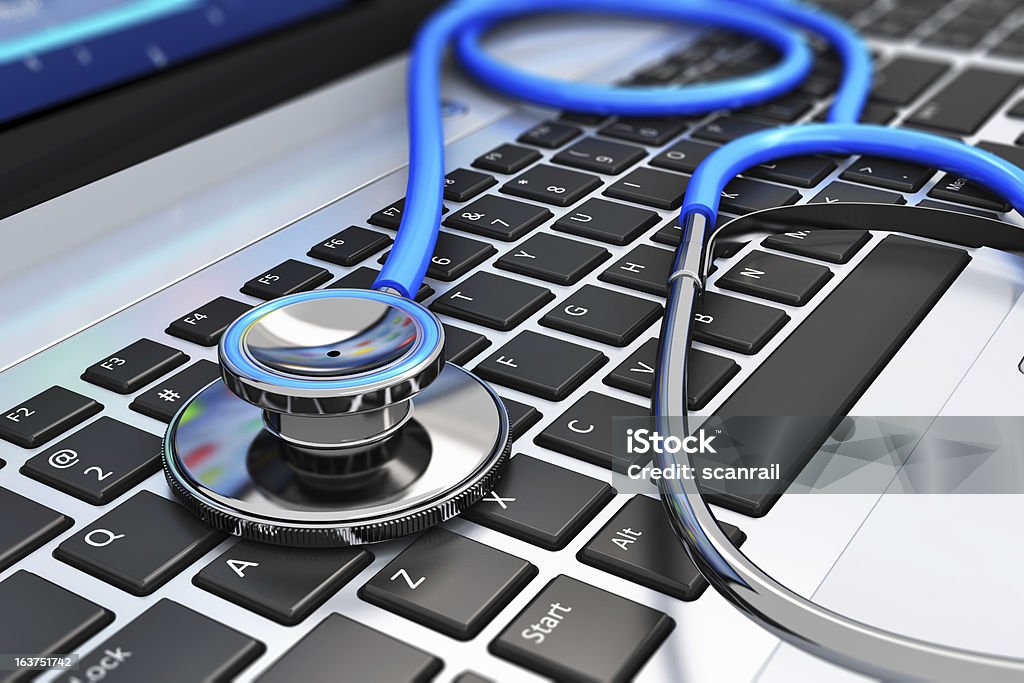 Estetoscópio no teclado do computador portátil - Royalty-free Cuidados de Saúde e Medicina Foto de stock