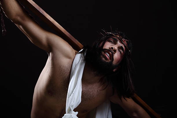 Jesus Christ Close up with the wooden cross on his back
