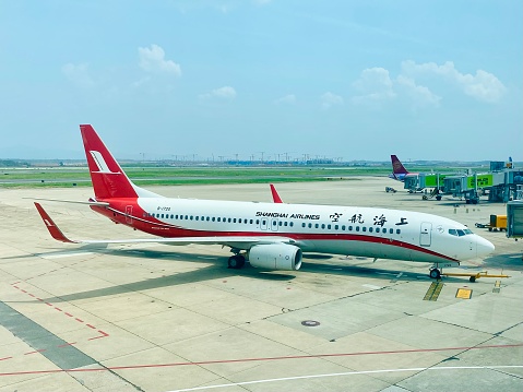Changsha, China- August 25, 2023: Summer is a busy season for Airlines in China after the COVID-19. Here is a Boeing 737 airplane of Shanghai Airlines in Changsha Huanghua International Airport.