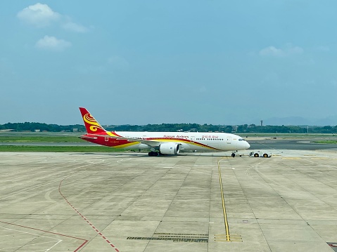 Changsha, China- August 25, 2023: Summer is a busy season for Airlines in China after the COVID-19. Here is a Boeing 787 airplane of Hainan Airlines in Changsha Huanghua International Airport.