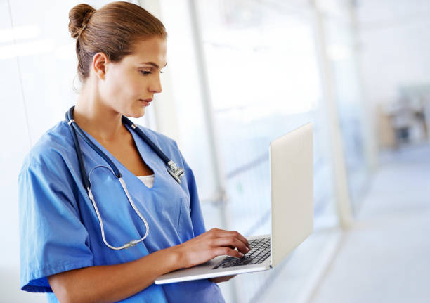 istock Updating her patient list 163752383