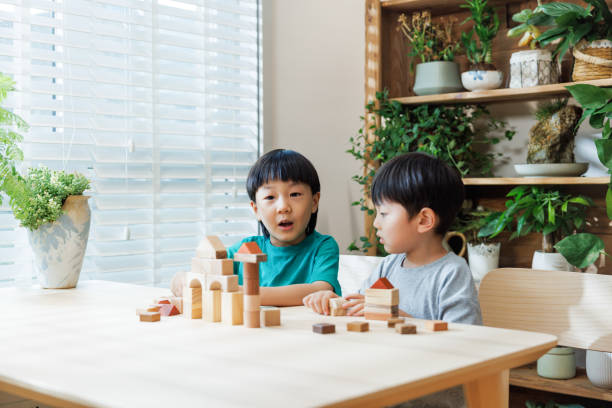 istock Asian boy has a great time playing with building blocks 1637523863