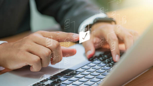 istock Businessman checking Document Management System (DMS) and approve. Streamline online docs, enhance file control & workflow efficiency with e-documents. 1637531291
