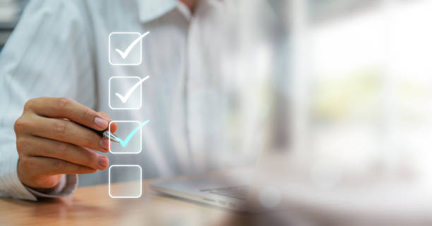 istock Businessmen point to tick correct sign mark in checkbox for approve quality document and project control. Excellence in document correction, ensuring quality and ISO certification for top Service 1637550446