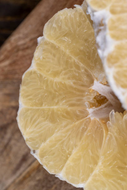 istock peeled pomelo on the table, close up 1637562734