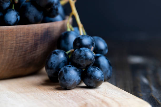 istock Unwashed blue grapes in the dust 1637564442