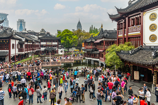 People at Yuyuan Market in Old City of Shanghai, China. The market grew up around Yuyuan Gardens and City God Temple in 19th century during the Qing Dynasty.