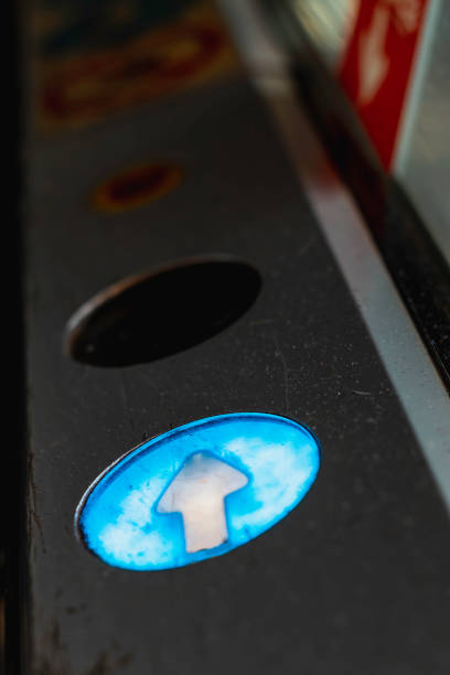 istock Right direction indicator lamp. White arrow over blue background. Escalator detail. Transportation sign. Close up 1637576375