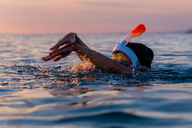 istock Snorkeling in Aegean Sea at sunset 1637583895