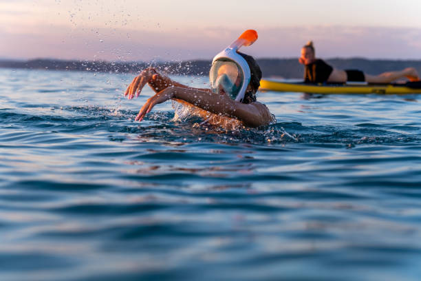 istock Snorkeling in Aegean Sea at sunset 1637583930