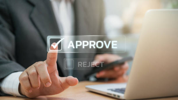 istock Businessmen point to tick correct sign mark in checkbox for approve quality document and project control. Excellence in document correction, ensuring quality and ISO certification for top Service 1637585606