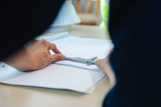 istock Group of engineer is discussion and brainstorming about condominium model of construction project 1637616241