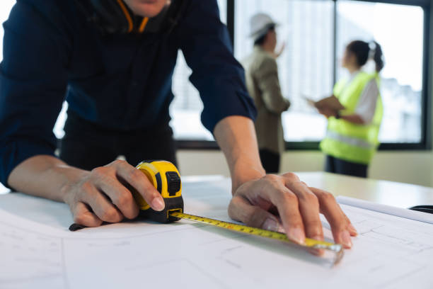 istock Group of engineer is discussion and brainstorming about condominium model of construction project 1637616764