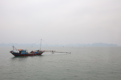 Traditional Vietnamese fishing boat on the bay