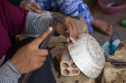 Artisan chiseling a bowl in Bali, Indonesia