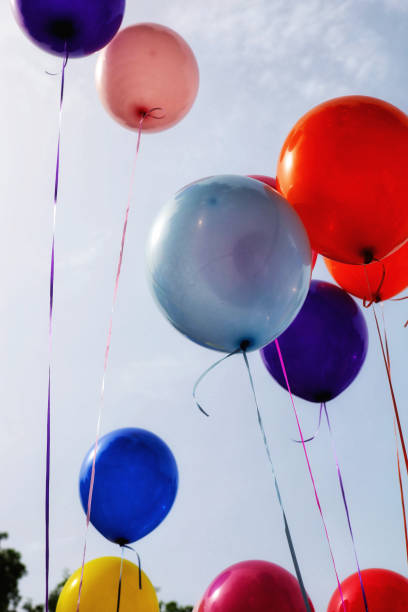 istock colorful balloons on a cloudy sky background 1637631235