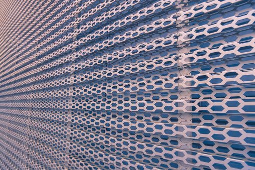 industrial metallic construction frame cells perspective sharped surface with slight pink and blue shades