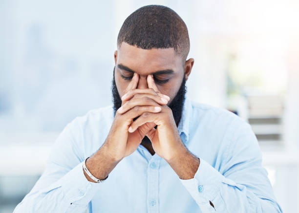 istock Stress, fail or tired businessman with headache overwhelmed by problems, mistake or stock market crash. Burnout, loss or frustrated black man trader overworked in office with fatigue or debt crisis 1637669644