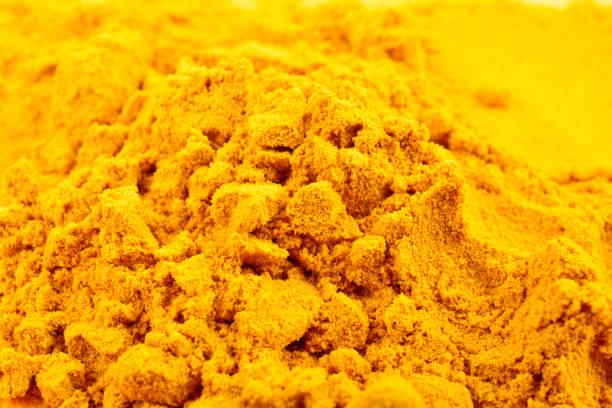 istock Closeup of haldi powder texture background 1637671821