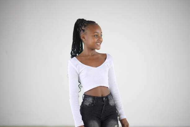 istock Young and Beautiful African Girl Studio Sideways glance Portrait 1637681059
