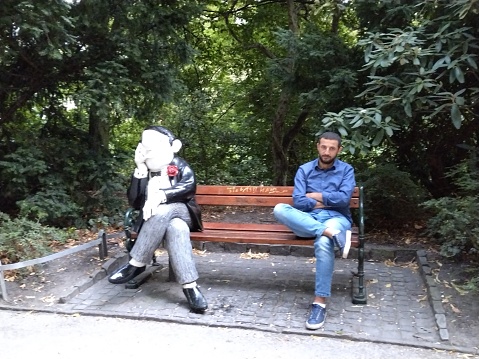 Man sitting with funny sitting statur in Bremen - wondeful old free Hanseatic city