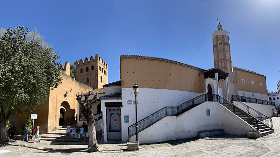 Morocco, Africa: view of Outa el Hamam, the central square of Chefchaouen dominated by the 15th century kasbah and the town Grand Mosque