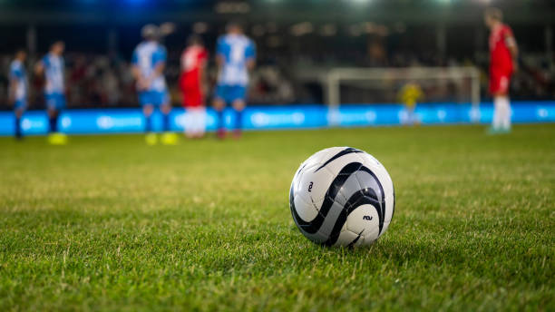 Football on grass Football kept on grassy football pitch. soccer field stock pictures, royalty-free photos & images