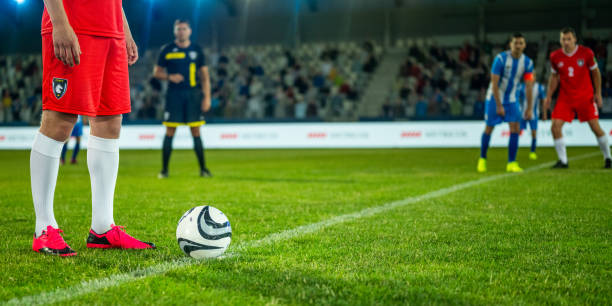 istock Football player ready to kick ball 1637717353