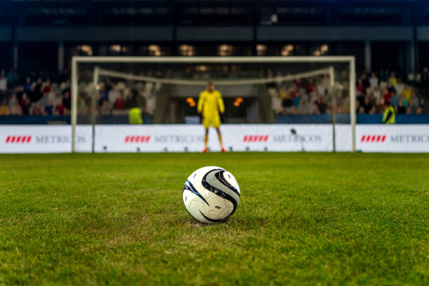 istock Football on grass 1637717354
