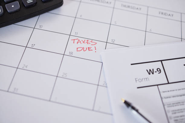 istock Tax, calendar and reminder on schedule for government compliance, deadline and remember date for paperwork and form. Taxes, financial audit and due payment of money, savings or income profit 1637726951