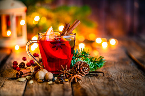 Christmas mulled wine mug on rustic table. Copy space Gluhwein or Christmas mulled red wine mug shot on rustic table. Copy space available at the right. High resolution 42Mp studio digital capture taken with Sony A7rII and Sony FE 90mm f2.8 macro G OSS lens punch drink stock pictures, royalty-free photos & images