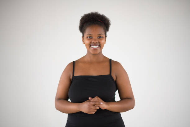 Happy Beautiful African Girl Studio Front View hands together Portrait