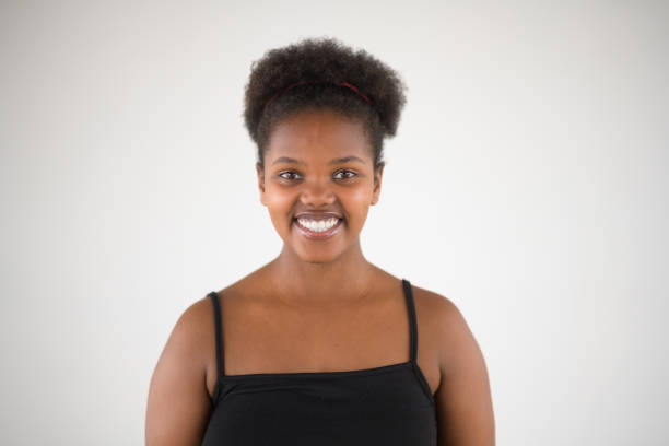 istock Happy Beautiful African Girl Studio Front View Headshot 1637756734