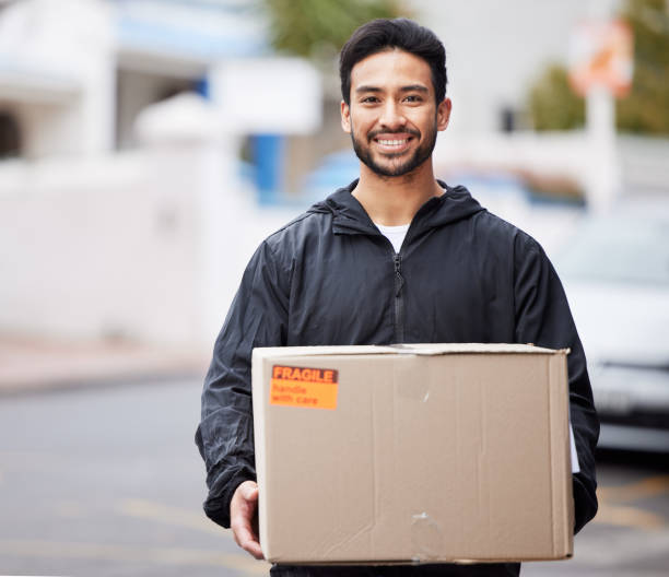 istock Delivery man, box and courier service for distribution, logistics and retail supply chain in outdoor portrait. E commerce, cardboard package and product, city shipping and happy face of stock worker 1637771980
