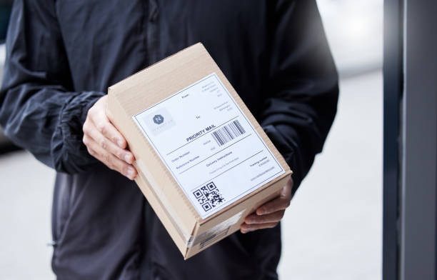 istock Box, hands and courier at entrance for a delivery, ecommerce work or cargo shipping. Closeup, logistics and man or person with a package, stock or front door freight wholesale or distribution service 1637771986