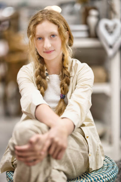 11-year-old girl shopping in the homeware section of a department store.