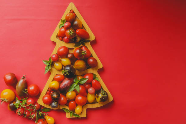 istock multicolored fresh tomatoes on a board for serving in the shape of a christmas tree for a snack holiday table 1637781992