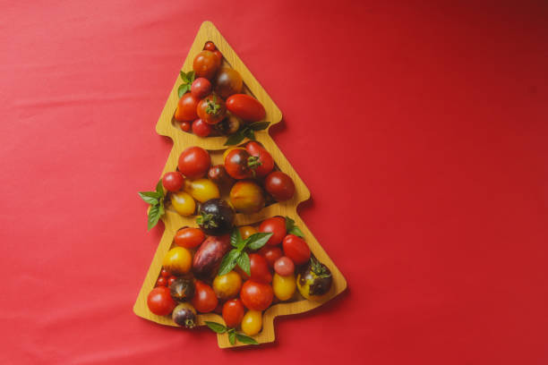 istock multicolored fresh tomatoes on a board for serving in the shape of a christmas tree for a snack holiday table 1637782318