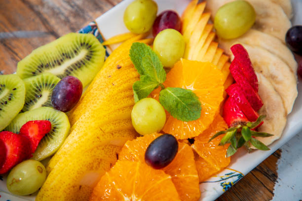 istock Close-up on fruit slices offered on tray on restaurant table 1637783580