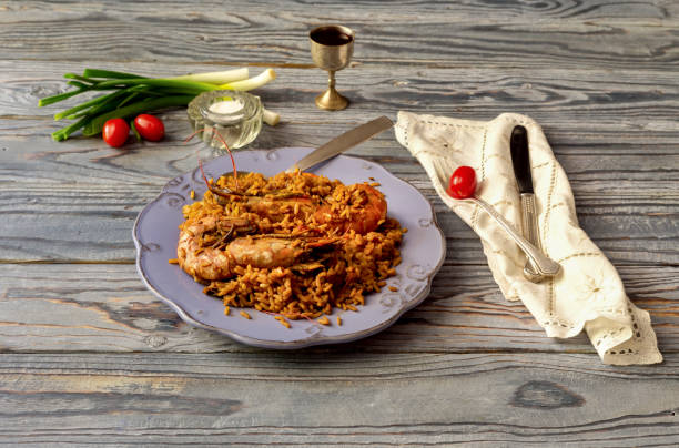 istock Shrimp pilaf on a wooden table 1637841437