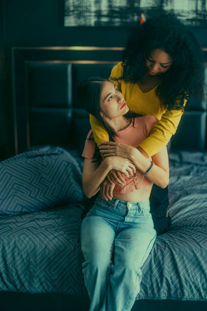 istock Lesbian couples playfully bond, sharing affectionate gazes, laughter, and intimate warmth on bed. 1637847387