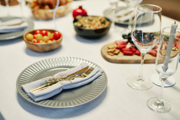istock Knife, fork and green spicy herb on folded napkin tied up together with thread 1637862564