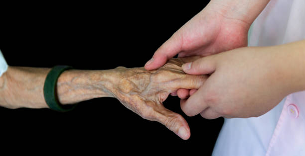 istock Young hands holding an old woman's wrinkled hands 1637872393