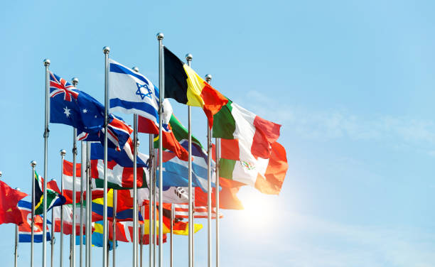 istock Set of flags fluttering in the wind against blue sky background 1637880565