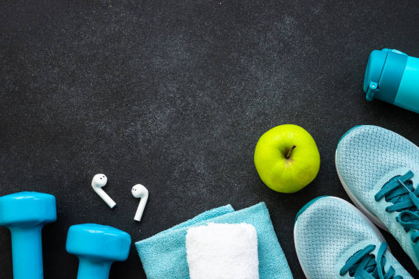 istock Fitness equipment at black background top view. 1637901884