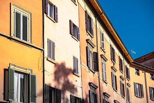 Exterior of residential houses connected to each other in Bologna, Italy