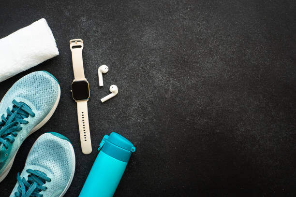 istock Fitness equipment at black background top view. 1637902430