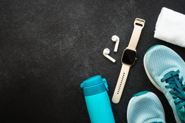 istock Fitness equipment at black background top view. 1637902431