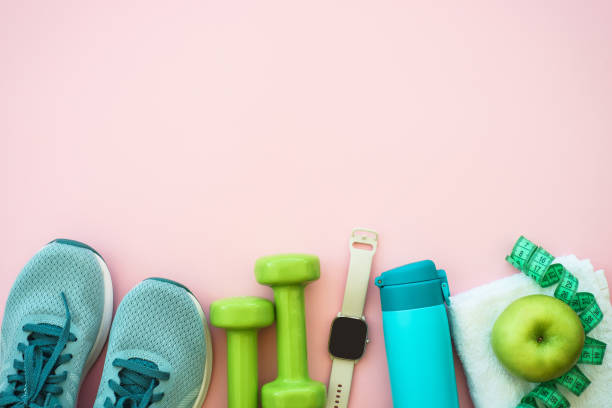 istock Fitness equipment on pink background, flat lay image. 1637903480
