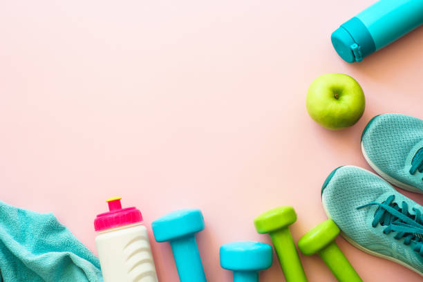 istock Fitness equipment on pink background, flat lay image. 1637912642